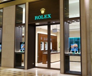Rolex store at Marina Bay Sands Singapore. Rolex SA is a Swiss luxury watchmaker. It is the largest single luxury watch brand, producing about 2,000 watches per day. SINGAPORE - APR 21, 2018.